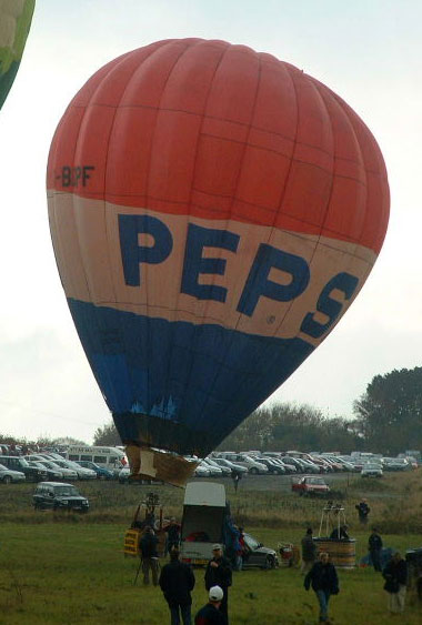 Balloon ready to launch, has red top, white equator and blue base, being Pepsi colours. The word 'PEPSI' appears in large blue lettering twice in the white band.