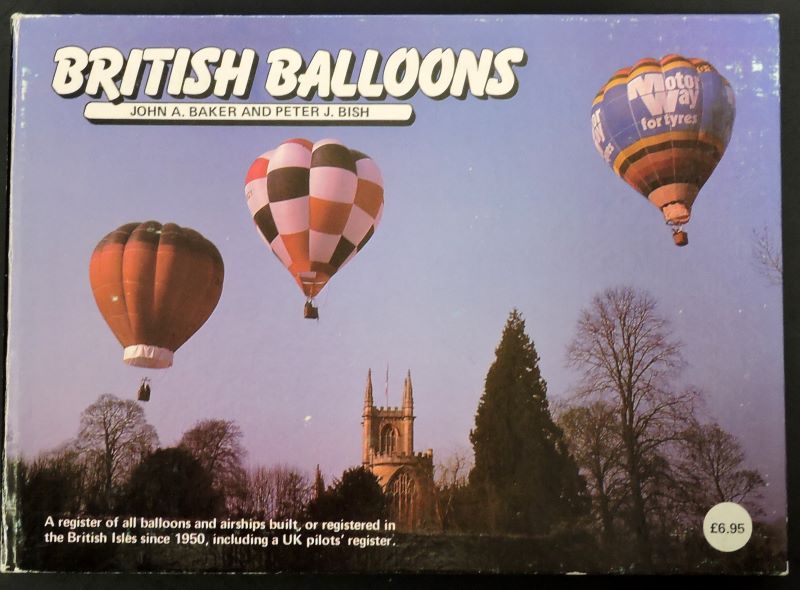 Showing 3 colourful balloons flying in the early morning winter sunshine over a church set amongst some trees.