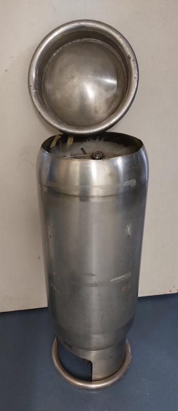 Propane gas tank pictured upside down with the base open, revealing the secret compartment.