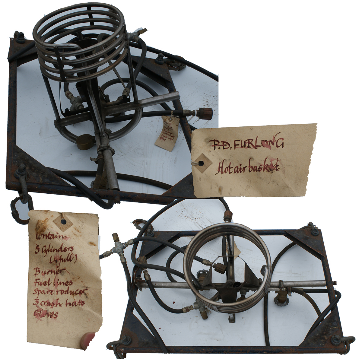 Single burner set in a rectangle black metal frame with fuel lines attached to the burner. The corners of the frame have the shackles for the flying wires.