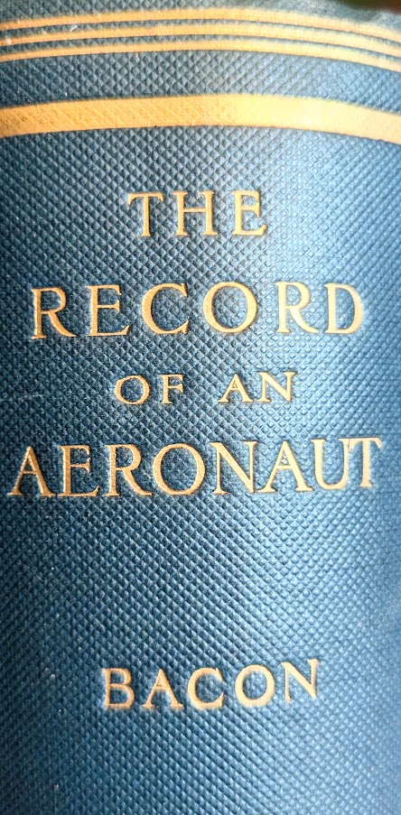 Spine of book with gilt lettering on blue cloth covers.