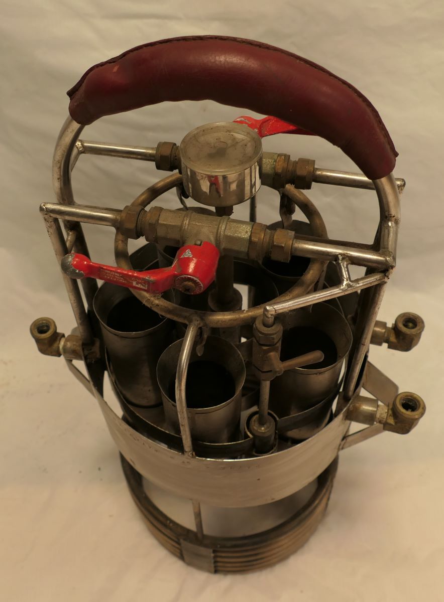 Angled pilot's view of the  burner clearly showing the on/off valves and gas pressure valve.