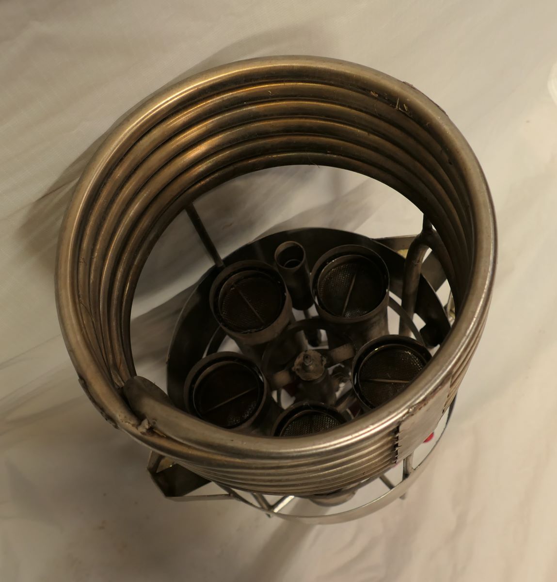 View looking down the single coil to the 5 burner jets within.