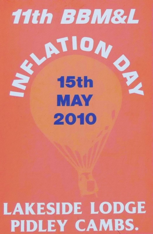 Orange background to sticker with a faint orange silhouette of a balloon in the centre and event date across the balloon. At foot of sticker is the location.