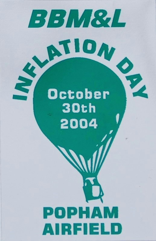 White background to sticker with a cyan silhouette of a balloon in the centre and event date across the balloon. At foot of sticker is the location.