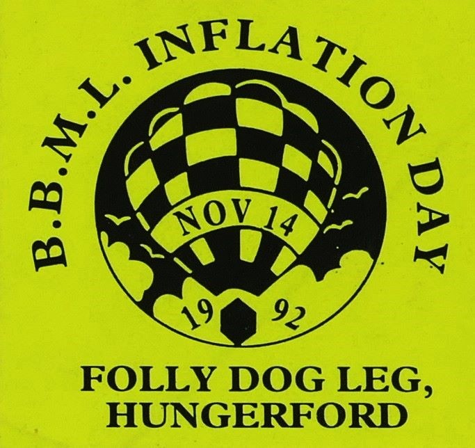 Yellow background to sticker with a black silhouette of a balloon in a circular background in the centre and event date across the balloon. At foot of sticker is the location.