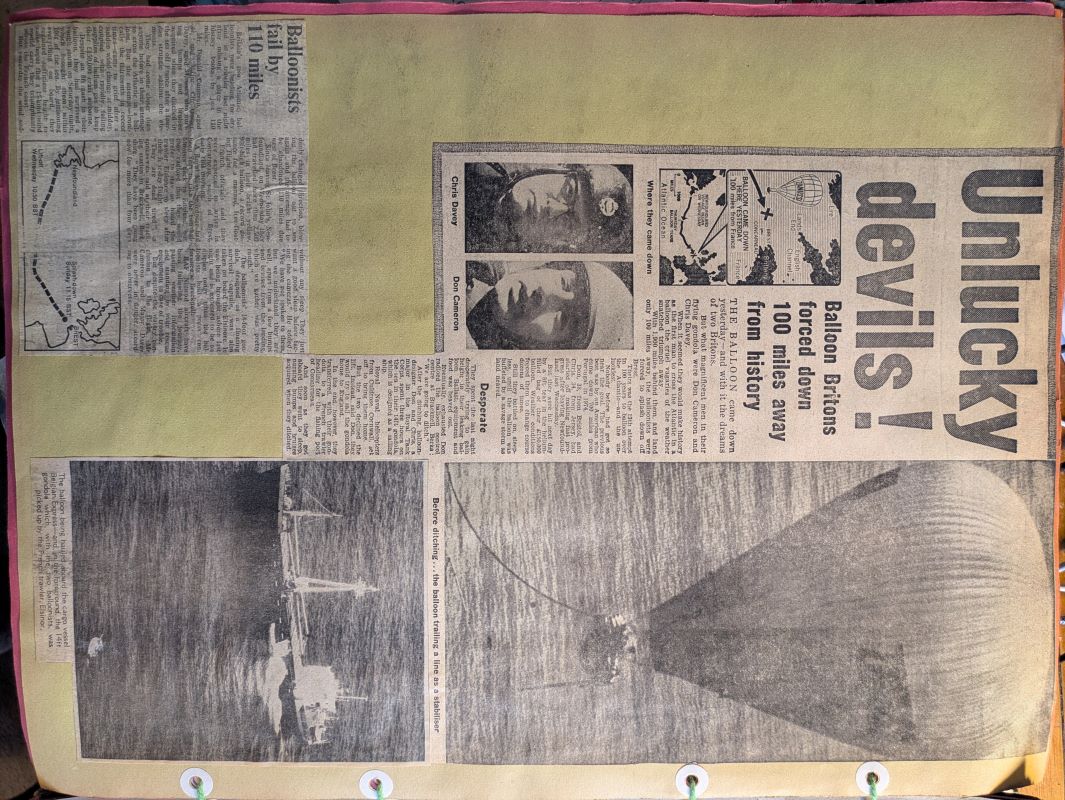 Picture of a page from a newspaper showing pictures of Don Cameron and Chris Davey and the balloon which they flew most of the way across the Atlantic Ocean