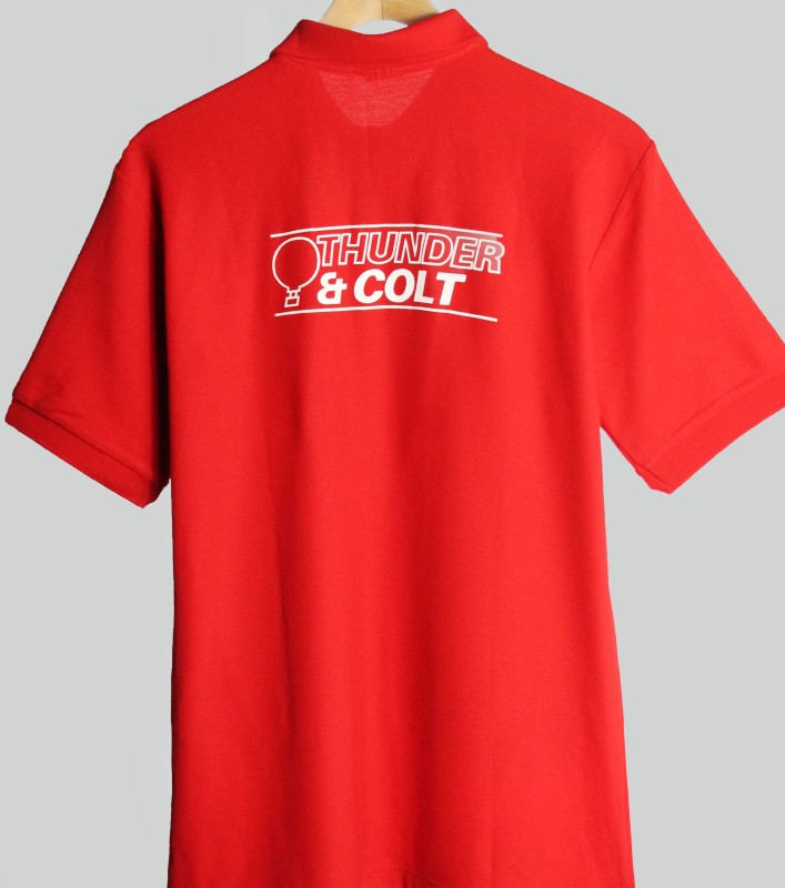 Back of red polo shirt with company logo in white.