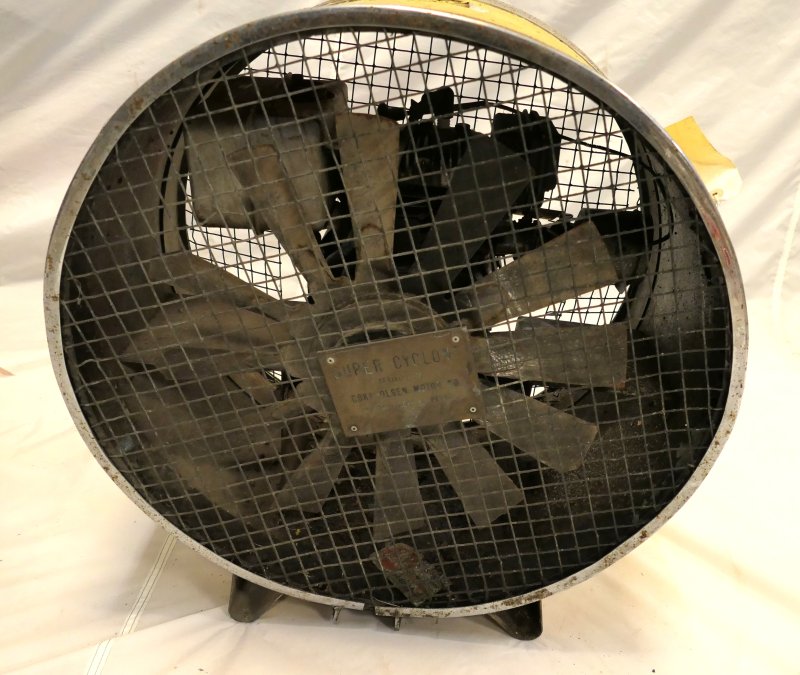 Large fan in a cage complete with shroud.   