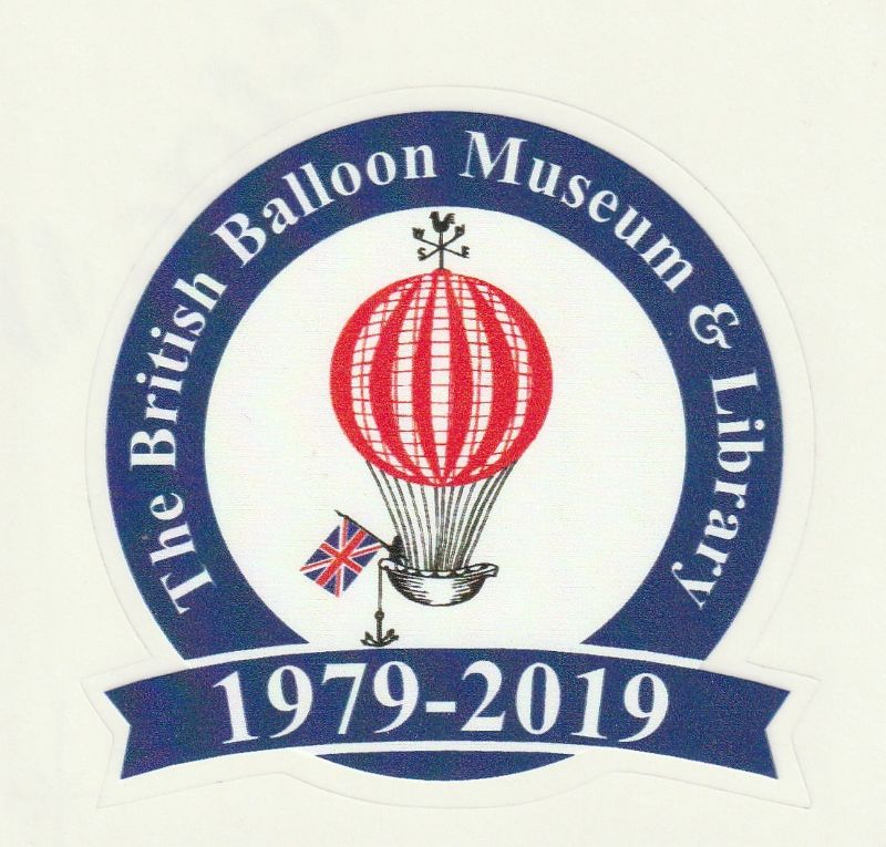 Circular sticker with a navy blue ring with the BBM&L name inserted in white. Centre of sticker features the red and white striped gas balloon logo. At base of sticker is navy ribbon with the years 1979 - 2019 in white.