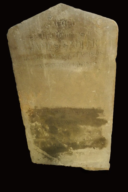 Plain headstone with a simple point at the top. Wording and no carved images.   
