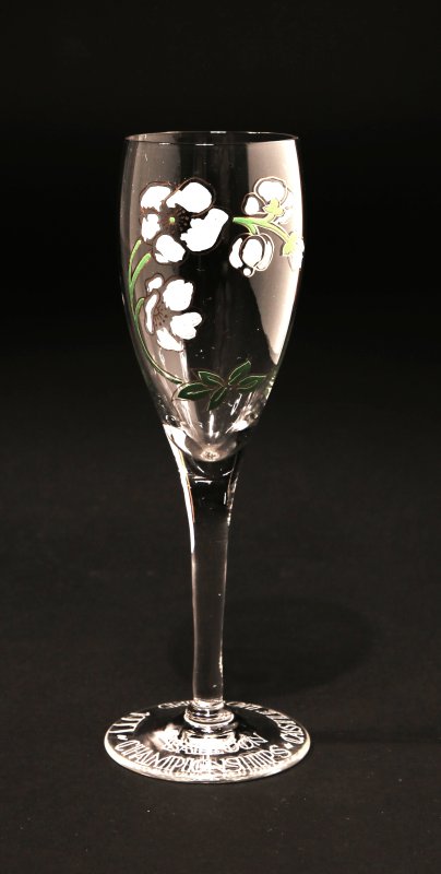 Glass flute hand painted with one sprig of white flowers and green leaves.   