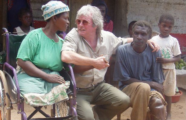 mike-with-landmine-victims-mozambique